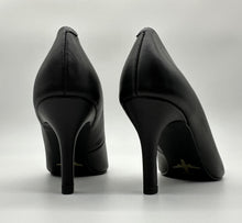 Load image into Gallery viewer, Classic black pump with a golden airplane image stamped against black outsole.
