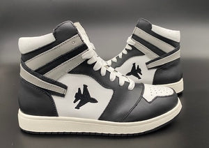 Black and white high top sneakers with Jet embroidered on the side with contrail.
